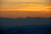 Солнце садится за хребет Тянь-Шаня. Вид с горы Дракона.