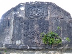 Над входом герб
