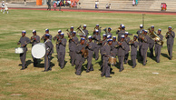 На зеленой траве поля шло действо. Девушки сменялись военно-морским (откуда в Свазиленде море?) оркестром.