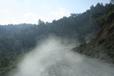 В горах часто асфальта нет — стоит жуткая пыль, поднимаемая проезжающими машинами