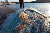 Рыбацкие сети на набережной лежат аккуратными горками